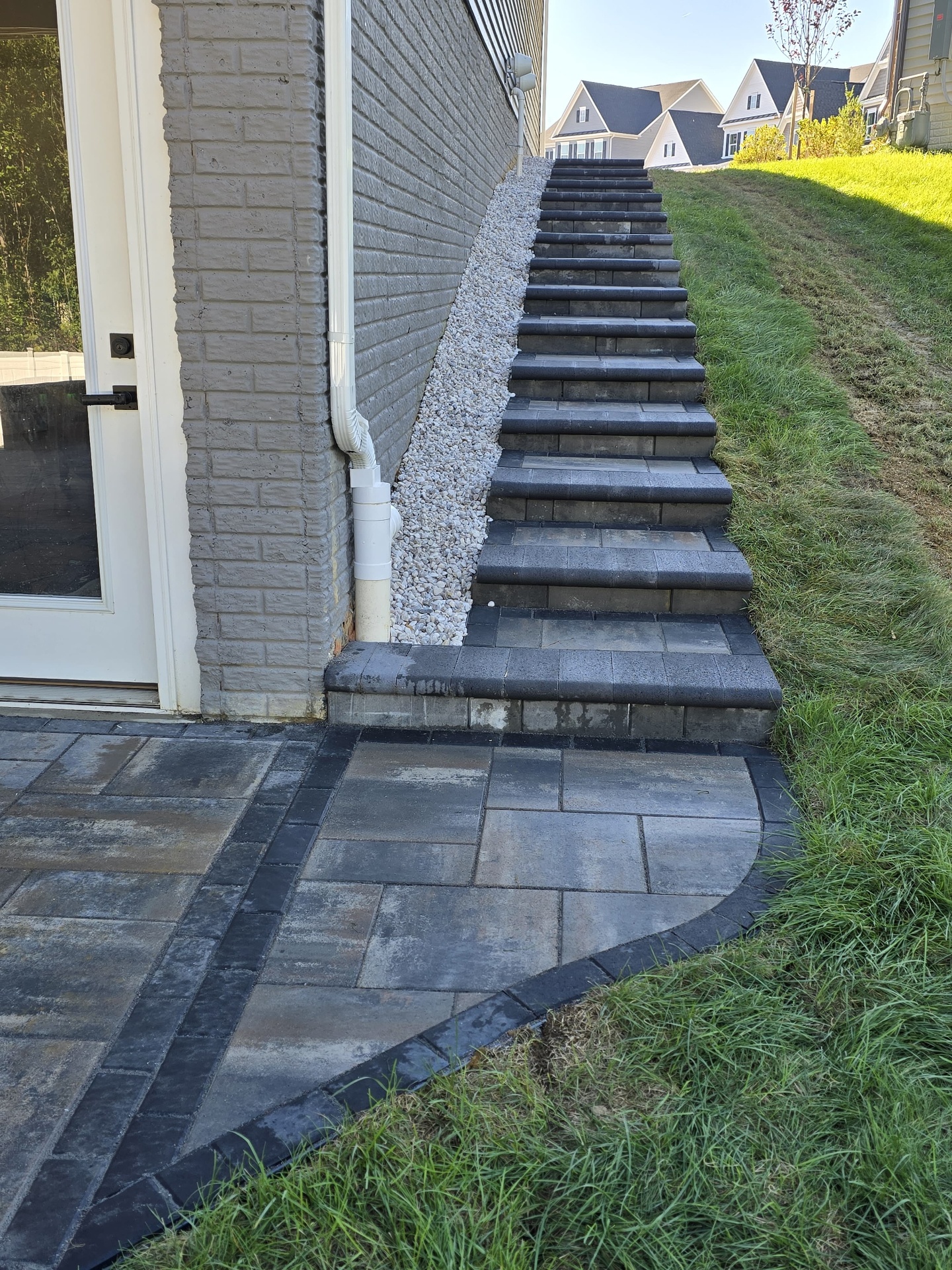 Paver patio with curved border and matching steps